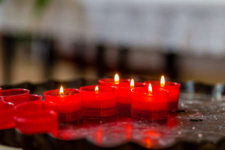 Cross formed of votive candles