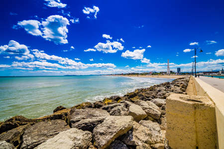 Panorama of the Adriatic Riviera in Romagna, Italy, with beaches, sea, umbrellas and hotelsの写真素材
