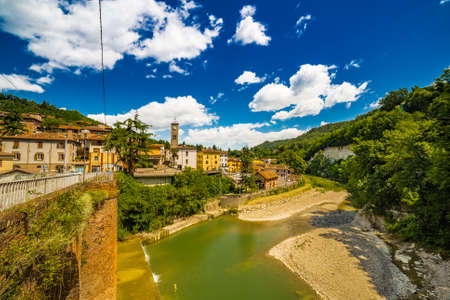 the old houses of a mountain village overlooking the riverの写真素材