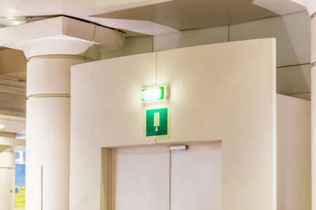 green sign indicating emergency exit