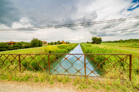 river in bucolic landscape of the countryside of Romagna in Italyの写真素材