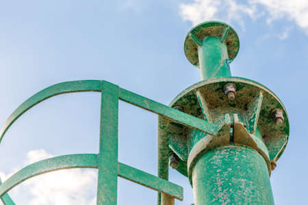 detail of green rusty lighthouse encrusted by saltの写真素材
