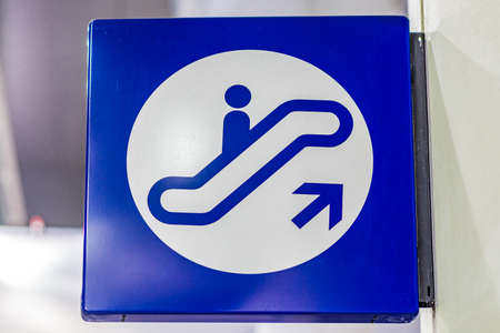 generic blue sign for escalators