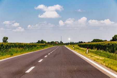 traveling on the highway on a summer day the sun is reflected on the photovoltaic panels of street...