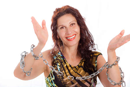 classy mature woman breaking chains isolated on white backgroundの写真素材
