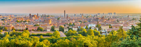 Aerial panoramic cityscape of Bologna, Italy,  above rooftops of  typical houses, ancient buildings and medieval towersの写真素材