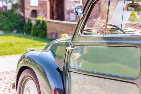 view from behind of the sinuous line of the bodywork of vintage carの写真素材