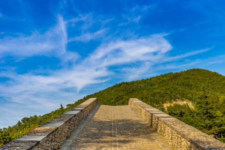 sloping ramp of 16th century humpbacked bridge in Emilia Romagna, Italyの写真素材