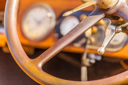 steering wheel and dashboard of a vintage car from the early twentieth centuryの写真素材