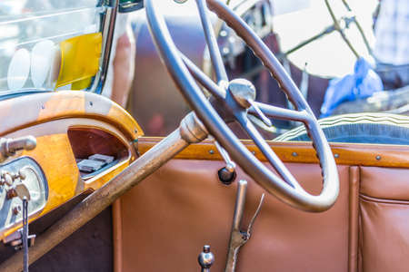 steering wheel and dashboard of a vintage car from the early twentieth centuryの写真素材