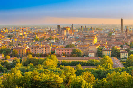 Aerial panoramic cityscape of Bologna, Italy,  above rooftops of  typical houses, ancient buildings and medieval towersの写真素材
