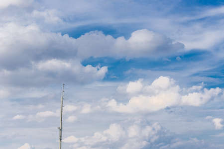 antenna on clouds in the blue skyの写真素材