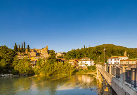 Typical ancient medieval village on river in Italyの写真素材