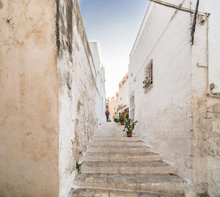 The Middle Eastern atmosphere of an alleyway in Ostuni, The White Cityの写真素材