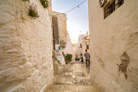The Middle Eastern atmosphere of an alleyway in Ostuni, The White Cityの写真素材