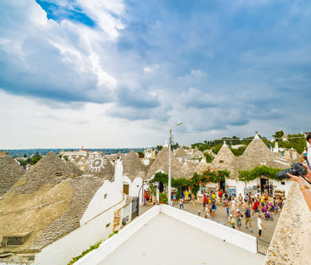 conical roofs of the trulli of Alberobello in Puglia, Italyの写真素材