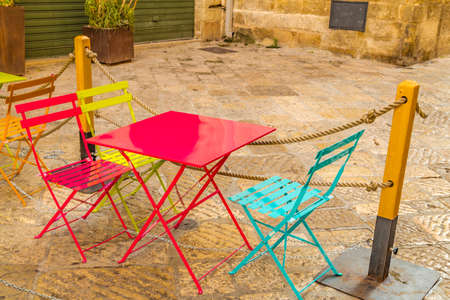 Chairs and tables in  ancient village in southern Italyの写真素材