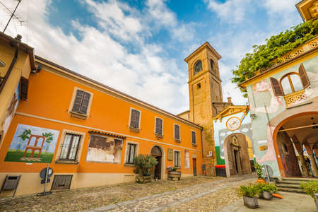 painted walls on cobbled lane in the medieval town near Bologna in Italyの写真素材