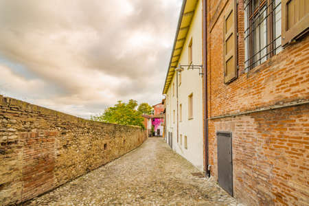 cobbled lane in the medieval town near Bologna in Italy