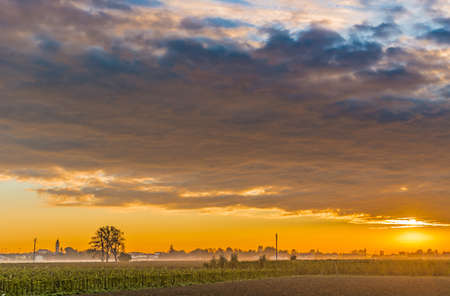 Dawn on cultivated fields in Italyの写真素材