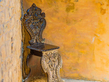 old wooden chair in a cornerの写真素材