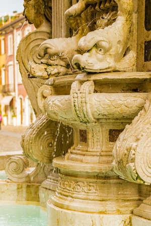 Ancient fountain in Italian townの写真素材
