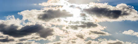 backlight blue sky with dark cloudsの写真素材