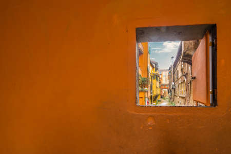 Bologna in winter, hidden window on old culverts