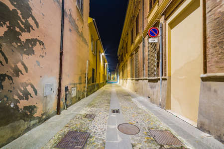 night view of narrow street in medieval village in Romagna, Italy