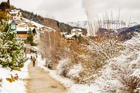 streets of a snowy Alpine village in Italy