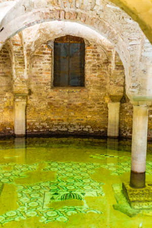 ancient flooded crypt with floor mosaics in Italyの写真素材