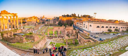 sunset above the ancient ruins of the Roman Forumの写真素材