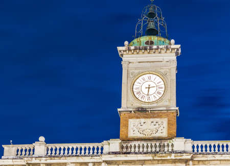 ancient clock tower at nightの写真素材