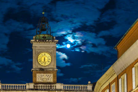 ancient clock tower at nightの写真素材