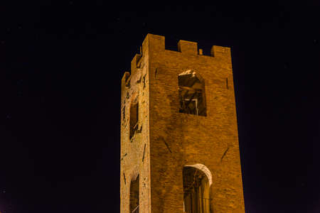 ancient medieval tower at nightの写真素材