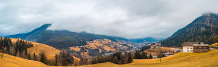 typical mountain village in alpine valley in Italyの写真素材