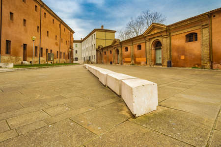 monumental marble bench in an open space among ancient buildings in Ravennaの写真素材