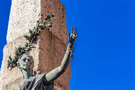 broken chain on the wrist of hand of female statue upwards raised in triumphのeditorial素材
