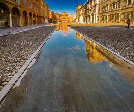 mirror of water of fountains in front of baroque Royal Palace in Modena, Italyの写真素材