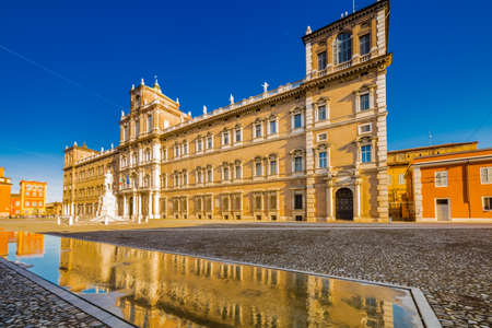 mirror of water of fountains in front of baroque Royal Palace in Modena, Italyのeditorial素材