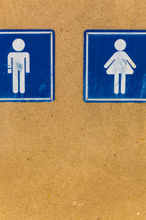 male and female icons on a dirty boardの写真素材