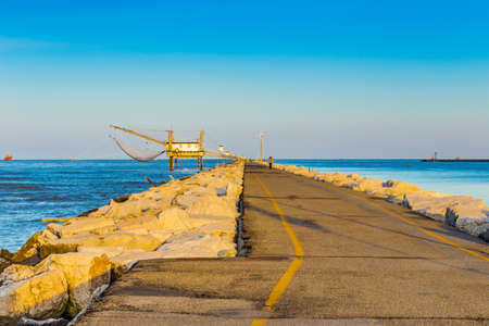 Traditional fishing huts on the dock in the Adriatic Seaの写真素材