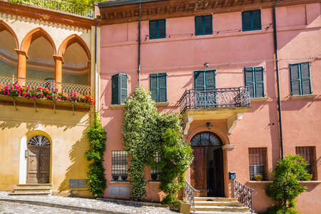 facade of ancient building in medieval village in Italyの写真素材