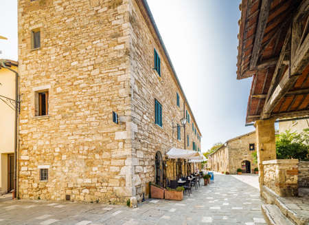 cobbled street of undiscovered medieval village in Italy under the sun of Tuscanyの写真素材