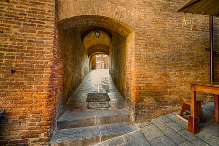 Architectural wonders of the ancient buildings of Siena, tuscan medieval town, Italyの写真素材