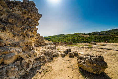 green weeds and arid rocks the  region of badlands under the sun of Tuscany in Italy