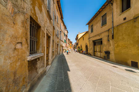 cobbled street of undiscovered medieval village in Italy under the sun of Tuscanyの写真素材
