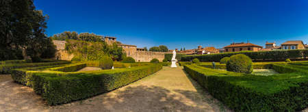 park of undiscovered medieval village in Italy under the sun of Tuscanyの写真素材