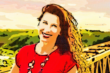 Smiling mature woman on an old iron bridge in countryside