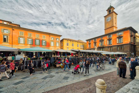 weekly street market in main square of Reggio Emilia in Italyのeditorial素材